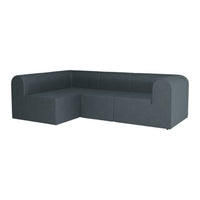 "Dark gray upholstered sectional sofa with smooth, minimalist design and subtle texture."