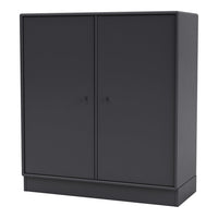 Sleek black storage cabinet with a smooth matte finish and minimalist design, ideal for modern interiors.