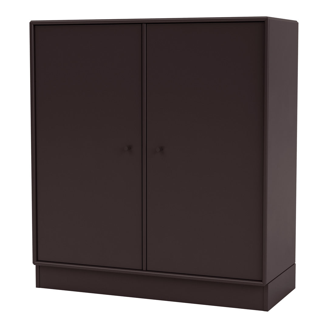 Dark brown minimalist storage cabinet featuring a smooth, solid surface and sleek design. Perfect for modern decor.