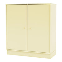 "Stylish yellow storage cabinet with a smooth finish and minimalistic design, perfect for any modern space."
