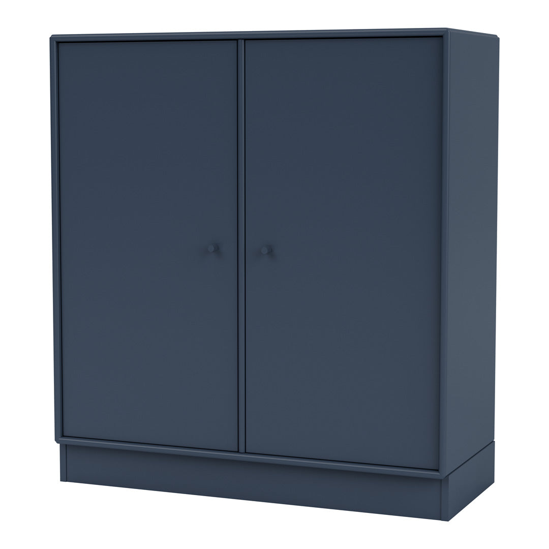 Navy blue cabinet with a smooth finish and minimalist design, featuring two simple doors and matching knobs.