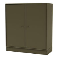 Olive green two-door cabinet with a smooth matte finish and minimalist design. Perfect for modern decor.