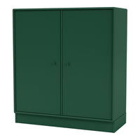Green two-door cabinet with a sleek, minimalist design and matte finish for a modern home aesthetic.