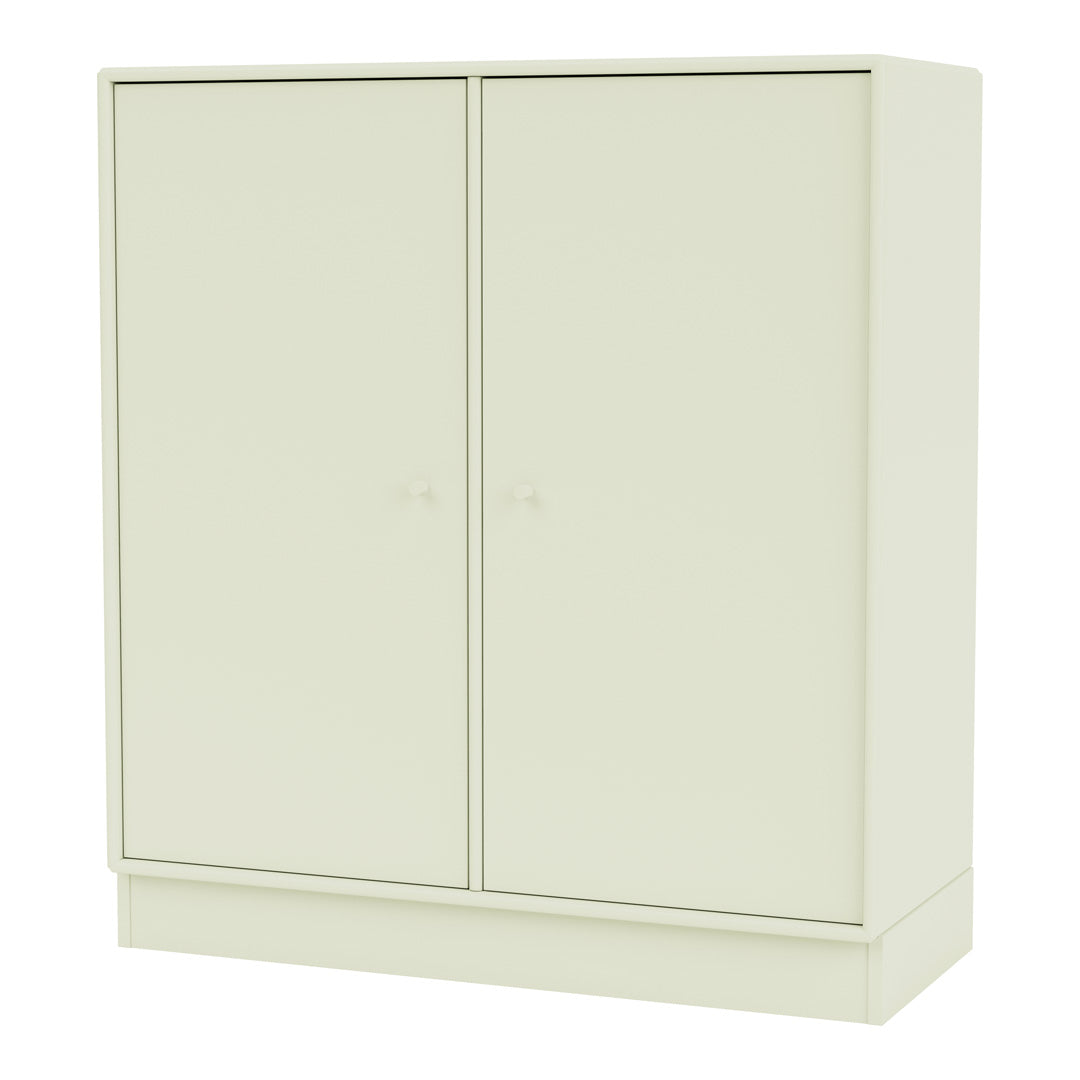 "Minimalist cream-colored cabinet with a smooth, solid surface and simple round knobs."