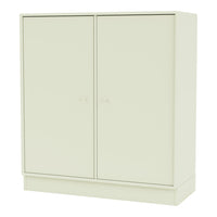 "Minimalist cream-colored cabinet with a smooth, solid surface and simple round knobs."