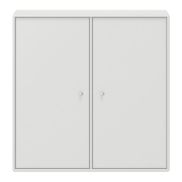 White cabinet with a sleek, minimal design featuring smooth surfaces and round knobs. Ideal for modern decor.