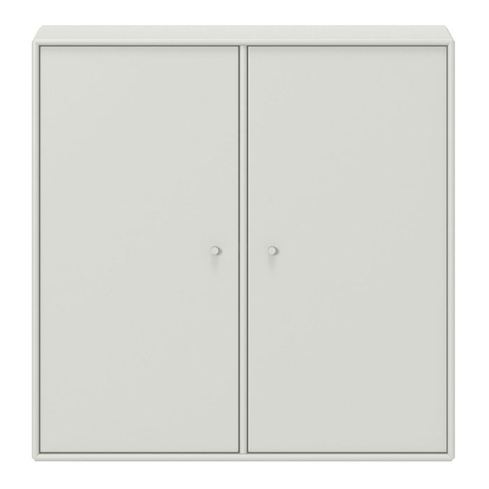 Minimalist light gray cabinet with smooth surface and two front doors, featuring round knobs for a sleek look.