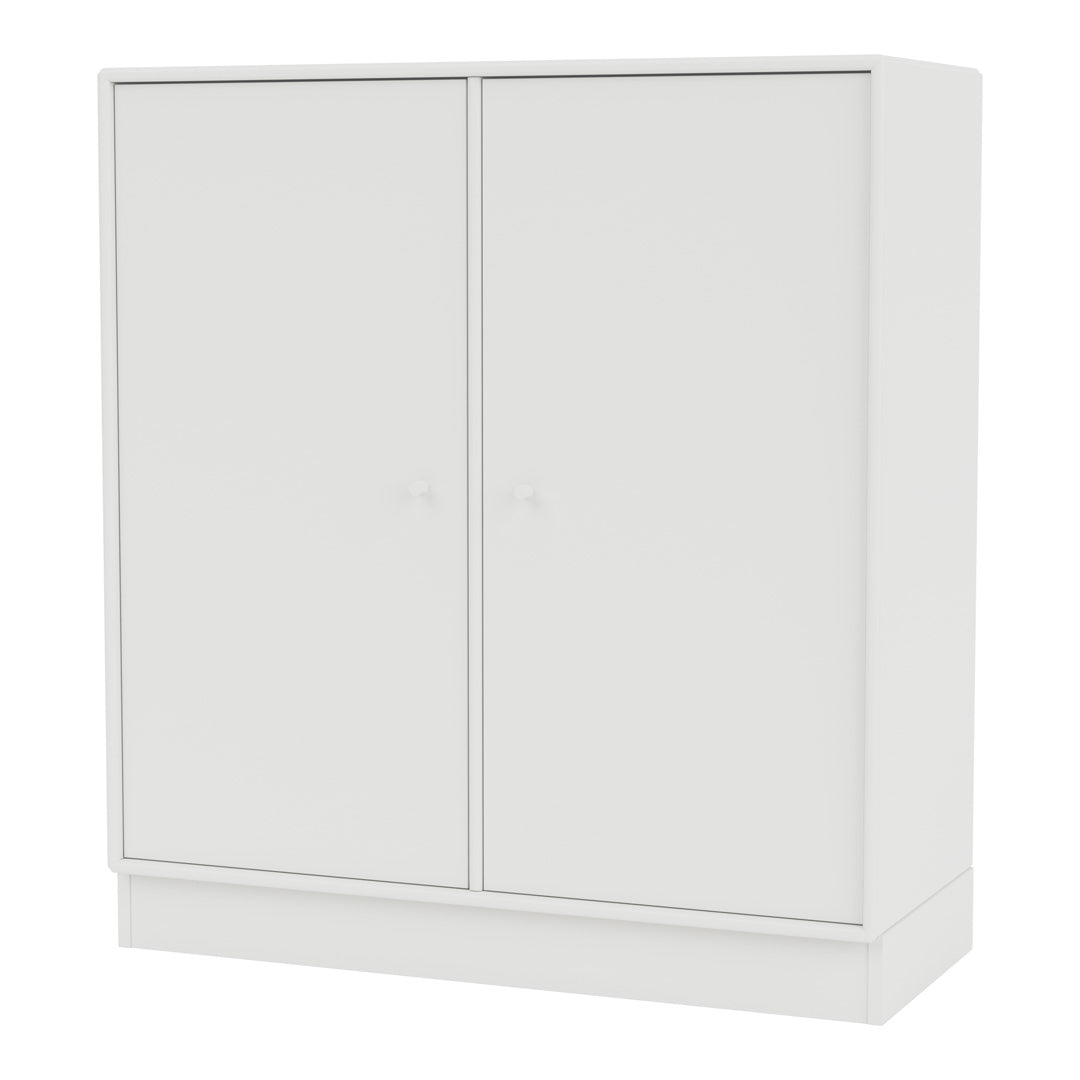 White modern cabinet with a smooth finish and minimalist design, featuring twin doors and simple knobs.