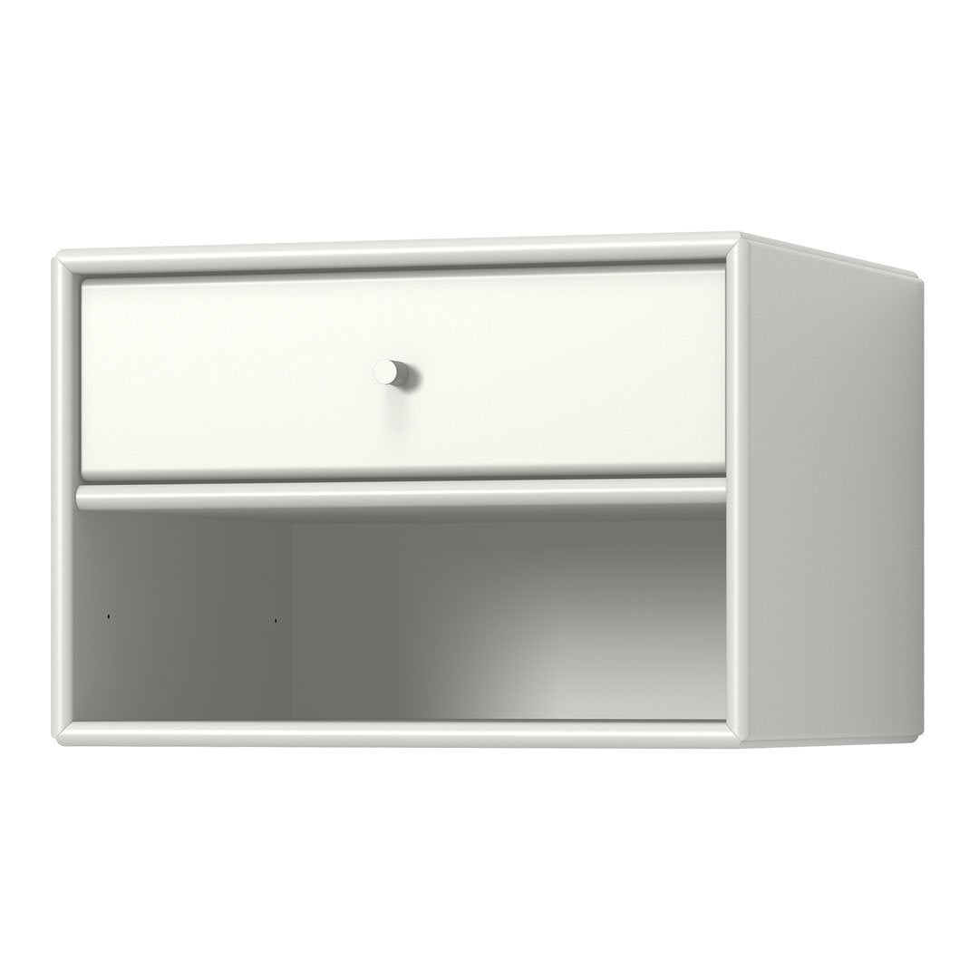 White wall-mounted shelf with a smooth finish, featuring a single drawer and open space below. Minimalist design.