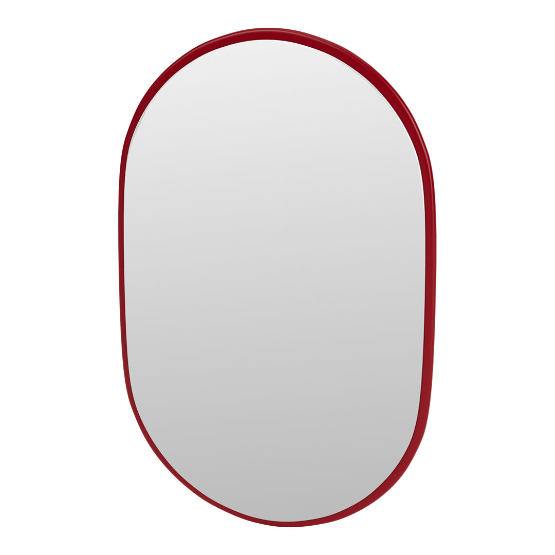 Red oval mirror with a smooth, glossy finish and minimalistic design, perfect for modern decor.