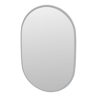 Oval mirror with a minimalist gray frame, featuring a smooth, reflective surface. Perfect for modern decor.