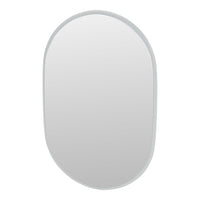 Oval mirror with a sleek, minimalist design featuring a soft gray frame and a smooth reflective surface.