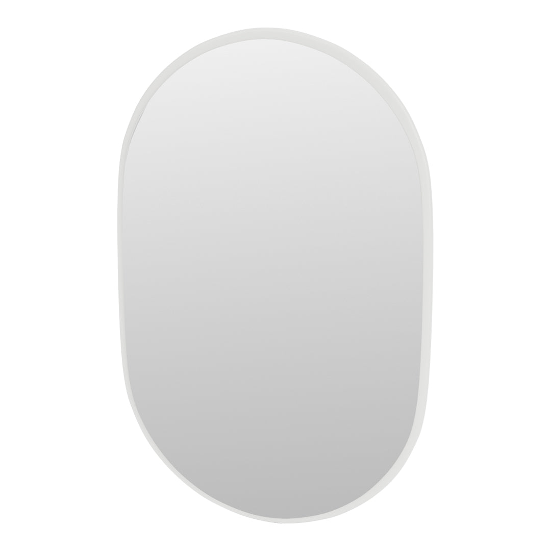 "Rounded mirror with a sleek white border, reflecting a clean, minimalist aesthetic."