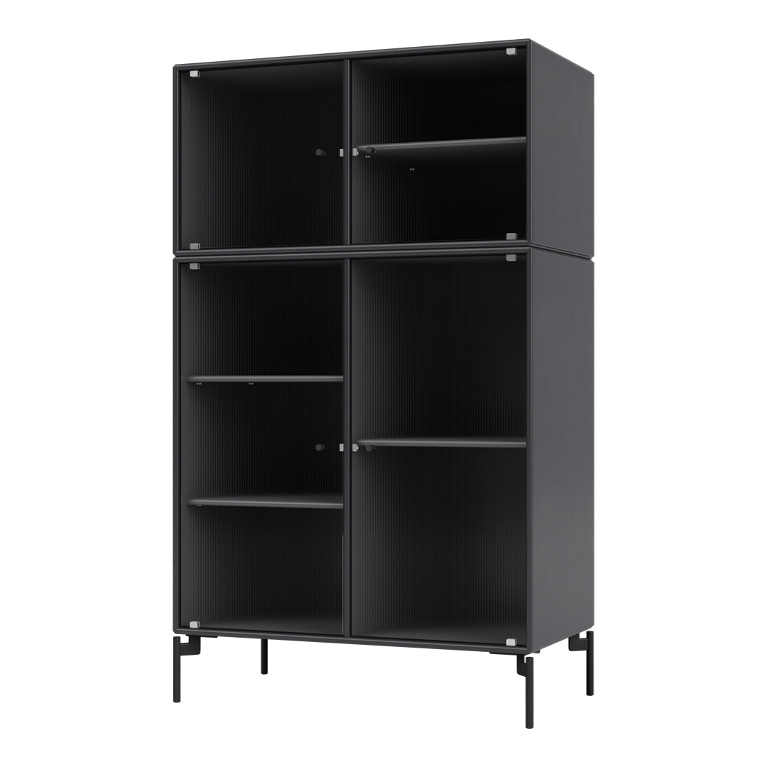 Modern black cabinet with ribbed texture and sleek metal legs, perfect for minimalist decor.