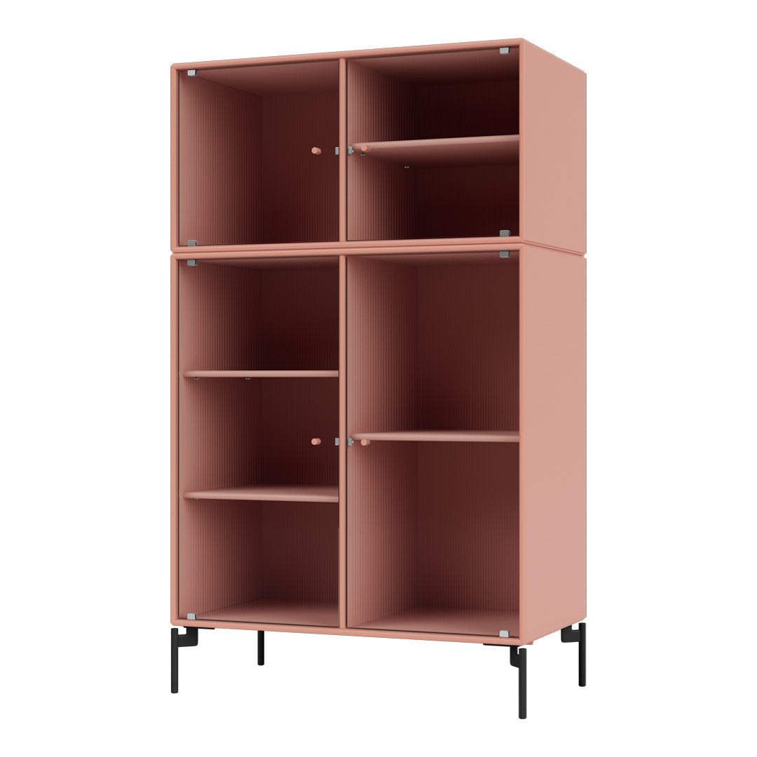 Pink ribbed storage cabinet with four compartments and black metal legs. Modern design perfect for any room.