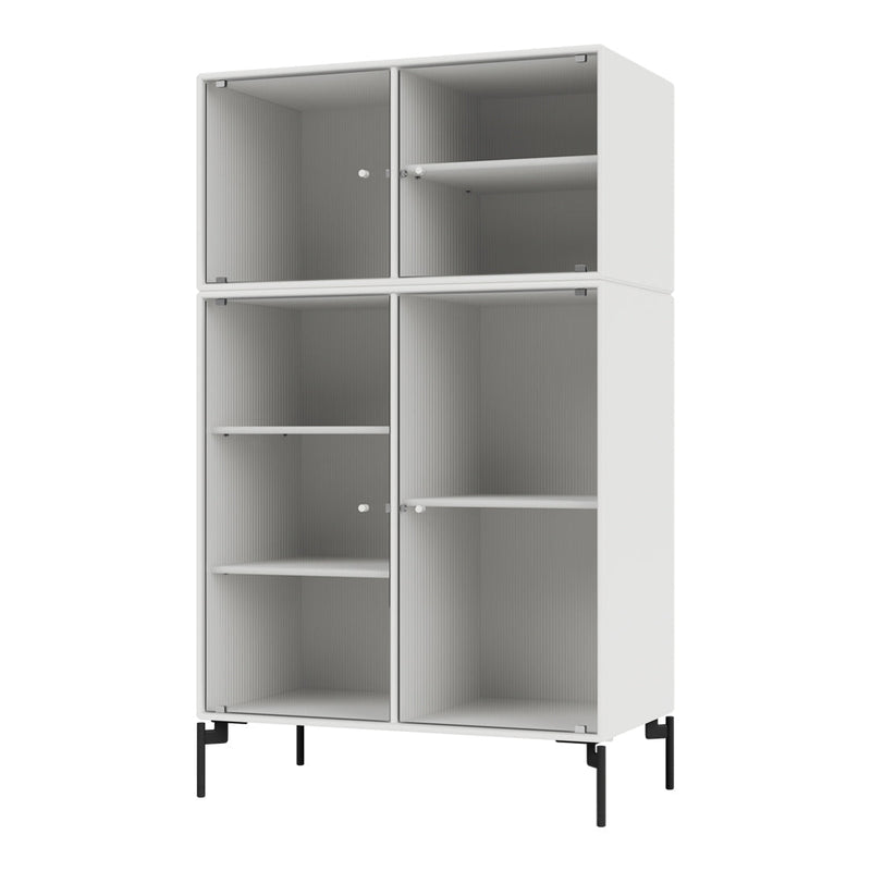 Modern white cabinet with ribbed pattern and black metal legs, featuring four open and closed shelving compartments.