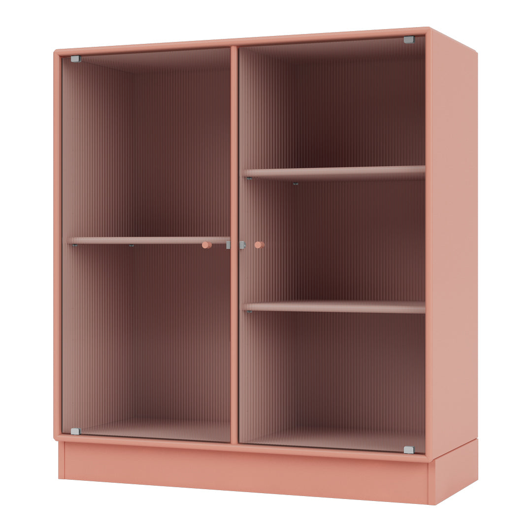 Coral pink cabinet with vertical ribbed texture and clear glass shelves. Modern and stylish storage solution.