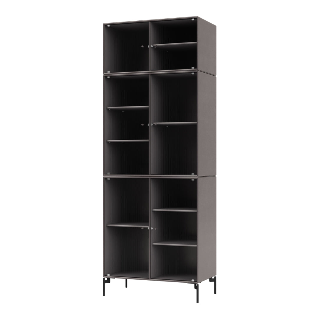 Tall black storage unit with a modern striped pattern and open shelves, perfect for organizing any space.