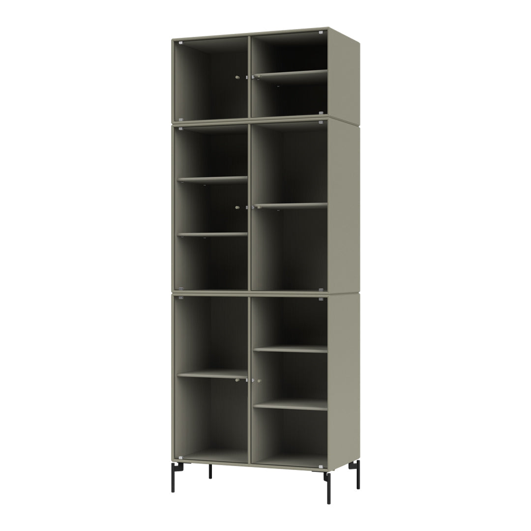Tall, muted green shelving unit with textured ribbed pattern and sleek black legs, offering a modern aesthetic.