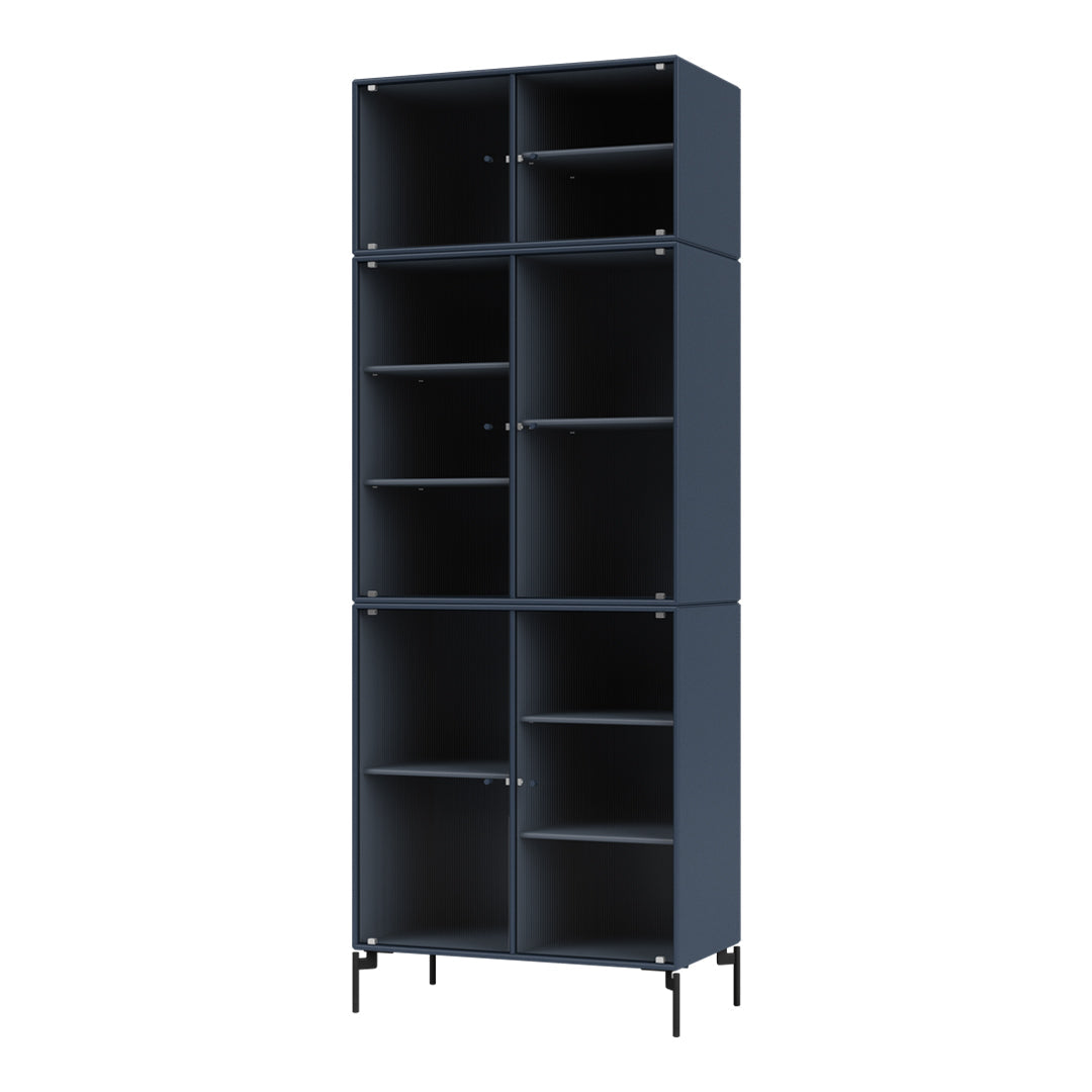 Tall navy blue shelving unit with a modern design and sleek lines, featuring a textured pattern.