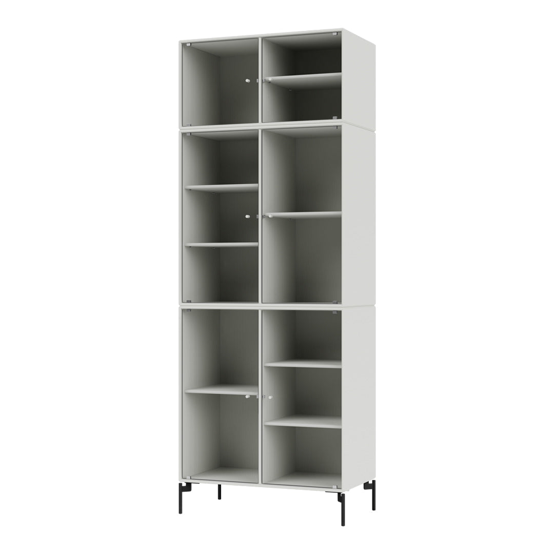 Tall gray shelving unit with spacious compartments and minimalist design, featuring smooth, vertical lines and neutral tones.