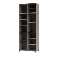 Tall modular bookshelf in soft taupe with vertical ribbed texture and black metal legs. Perfect for modern decor.
