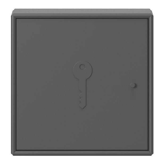 Gray key storage box with a smooth matte finish and a simple keyhole design. Ideal for modern interiors.