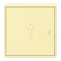 Cream-colored wall key holder with a sleek, minimal design and subtle embossed key motif.