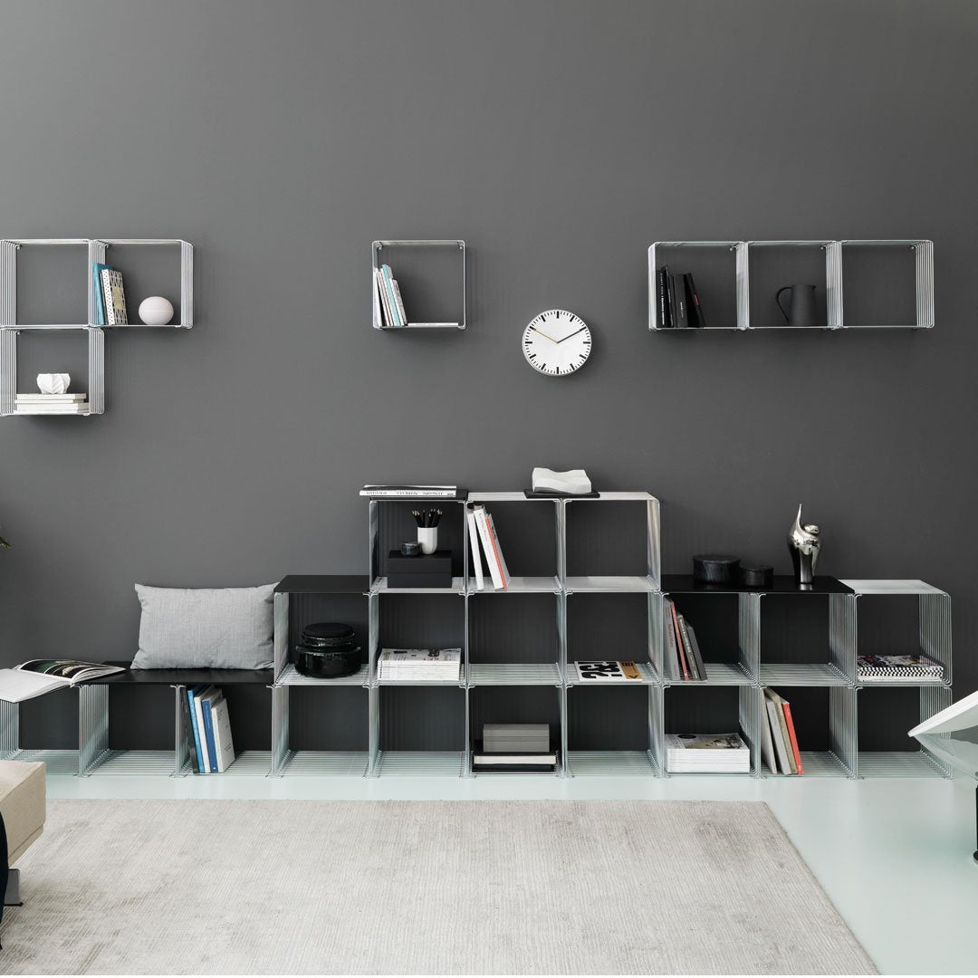 Modern modular shelving in grey and transparent acrylic, accented with black elements. Stylish minimalist design.