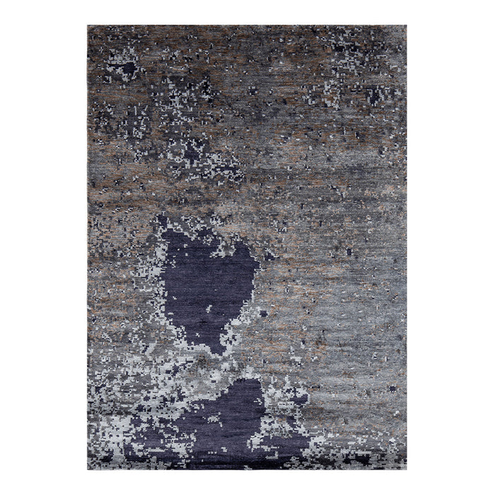 "Abstract grey and navy rug with textured patterns and distressed finish."