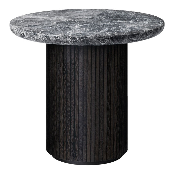 Round table with a mottled black and gray marble top and a textured dark wood base featuring vertical grooves.
