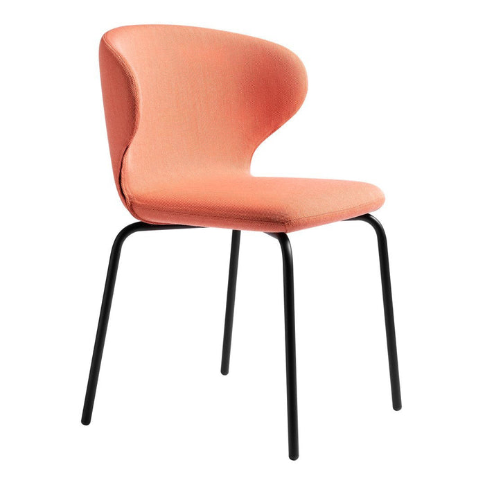 Peach-colored chair with a smooth, curved design and black metal legs. Modern and minimalistic style.