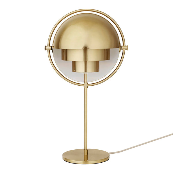 Modern brass table lamp with a sleek round shade and minimalist design. Adds elegance to any decor.