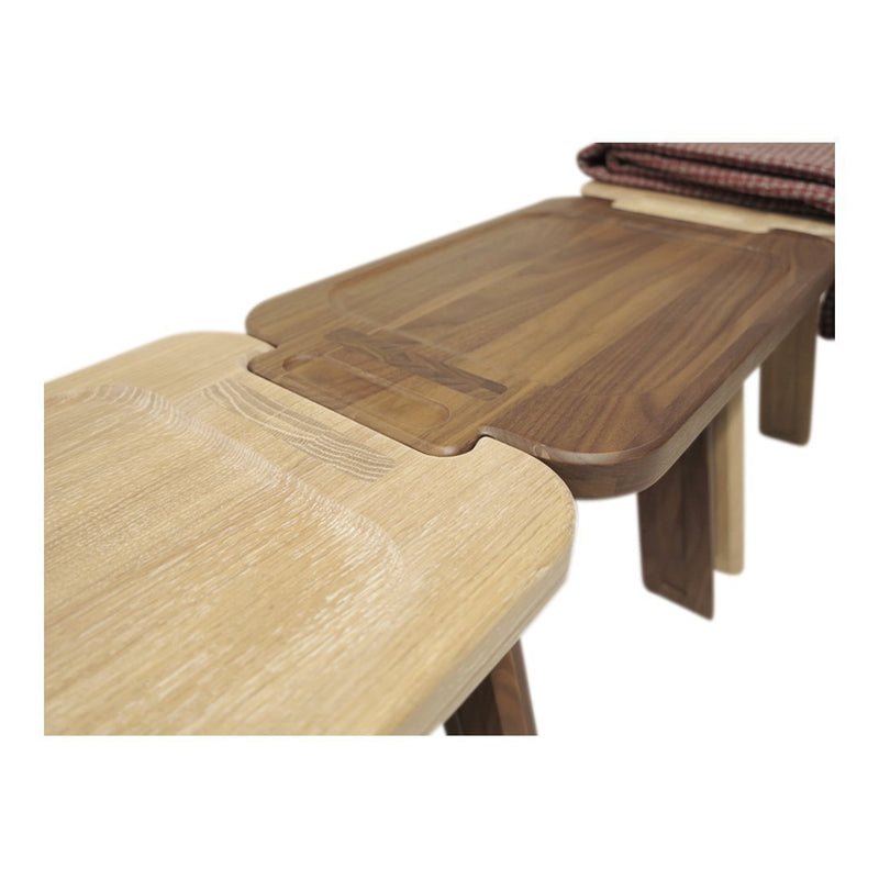 Wooden table with a mix of light beige and rich walnut tones; smooth surfaces and seamless joinery design.