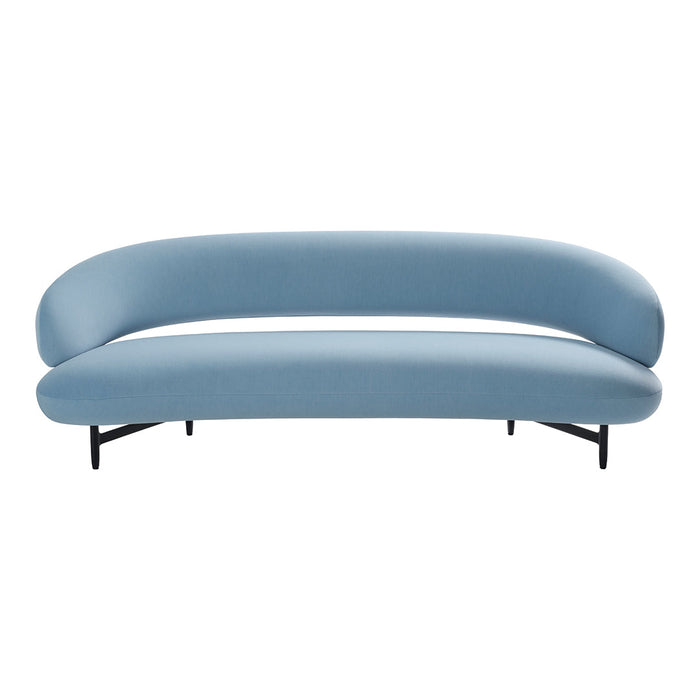 Curved modern sofa in soft pastel blue fabric with sleek black legs. Ideal for stylish living spaces.