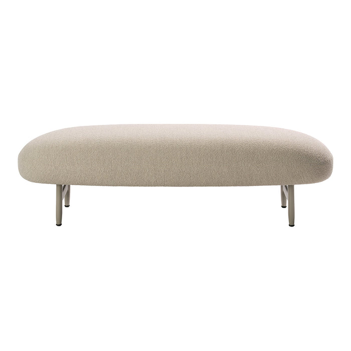 Beige oval ottoman with smooth fabric and sleek metal legs, perfect for modern living spaces.