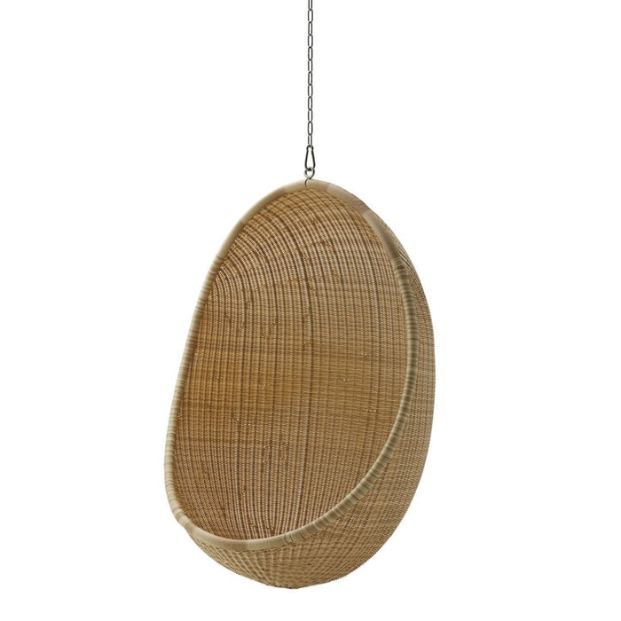 Hanging wicker basket in natural rattan color with smooth, oval shape and intricate woven pattern.
