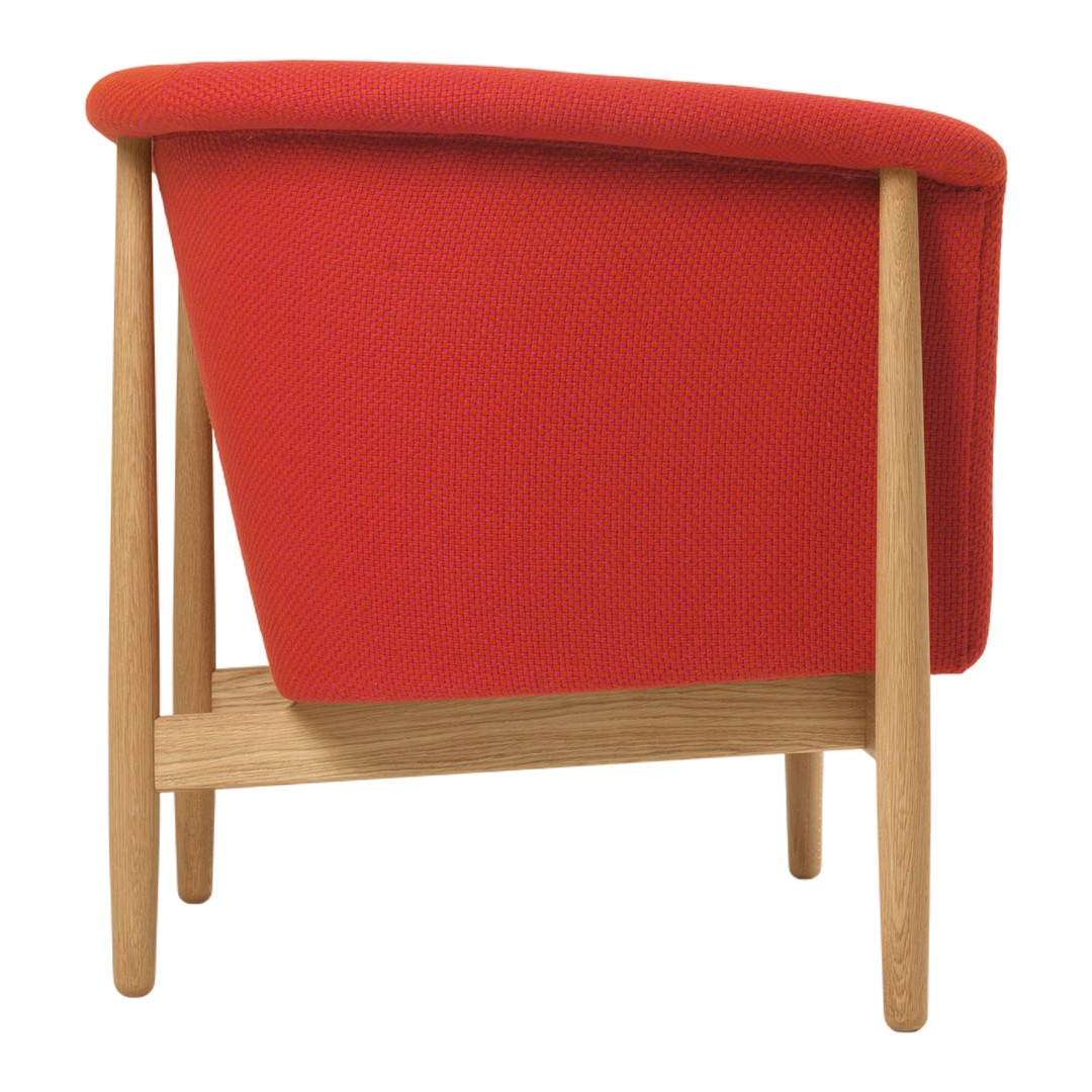 Red upholstered chair with a sleek design and wooden legs, showcasing a modern, minimalist aesthetic.