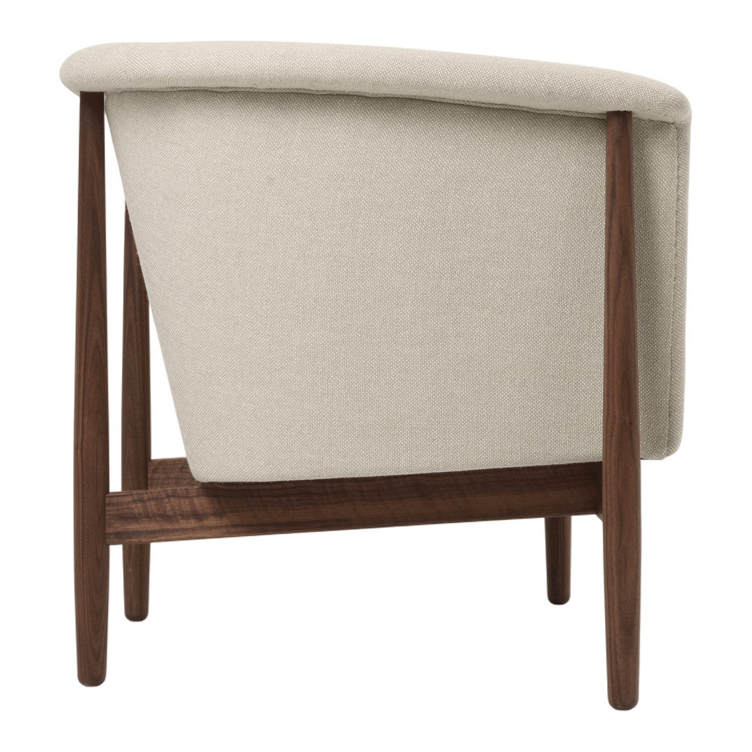 Beige upholstered chair with a sleek wooden frame, showcasing a minimalist and modern design.