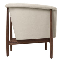 Beige upholstered chair with a sleek wooden frame, showcasing a minimalist and modern design.