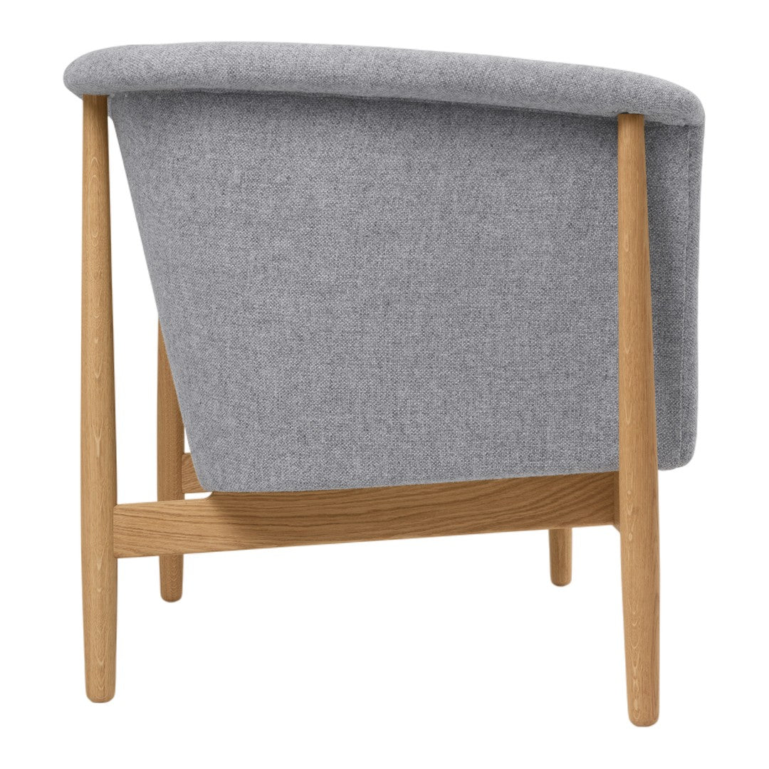 Gray upholstered chair with a smooth texture and natural wooden legs, showcasing a minimalist, modern design.
