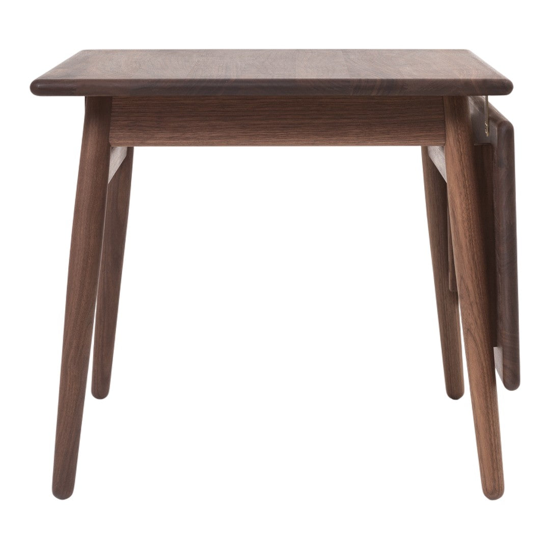 Brown wooden side table with sleek, minimal design and tapered legs. Features a smooth finish and natural wood grain pattern.