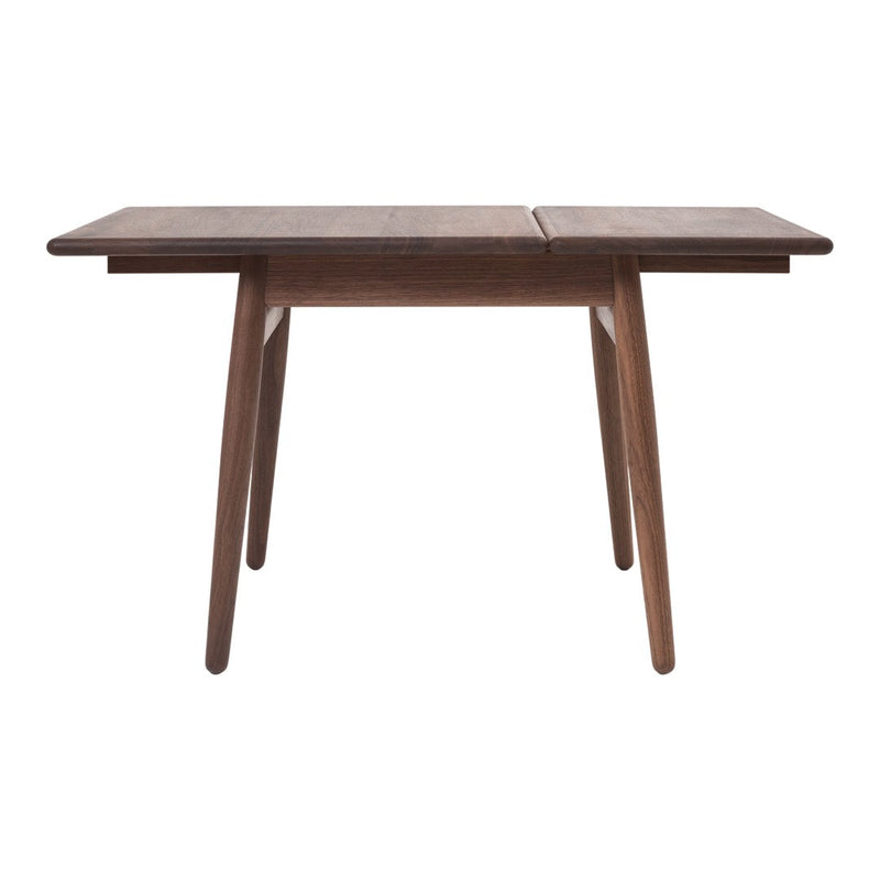 Brown wooden dining table with a sleek, minimalist design and natural wood grain pattern. Perfect for modern decor.