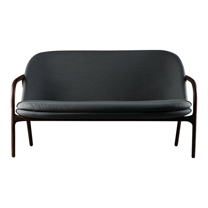 Black leather sofa with smooth texture and matte finish, featuring sleek wooden legs for a modern touch.
