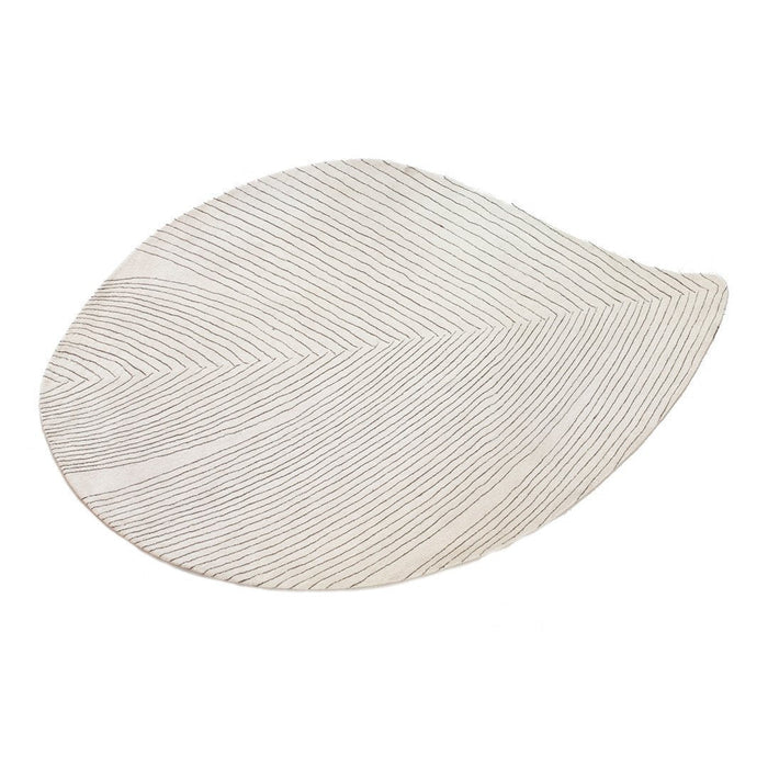 White leaf-shaped platter with subtle textured lines, adding elegance to any table setting.