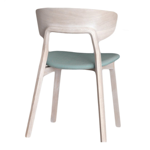 Light wood chair with a smooth finish and soft mint green cushioned seat. Simple, modern design.