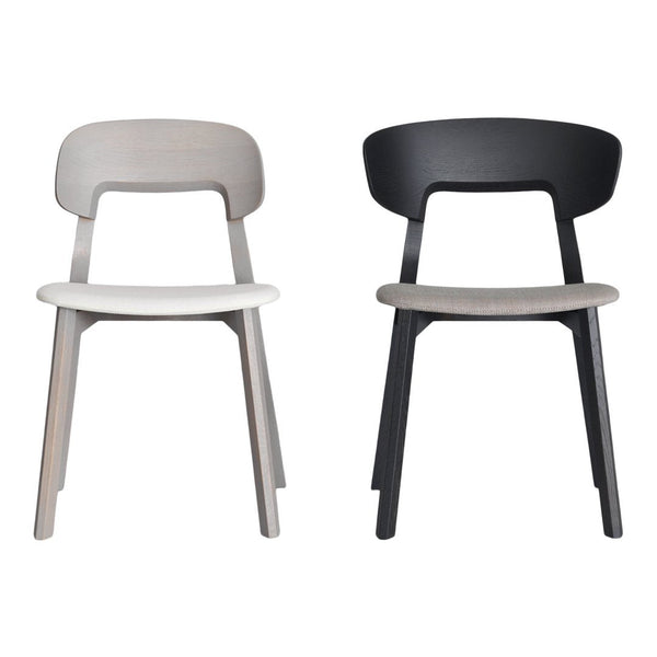 "Set of two minimalist chairs: one in light gray and one in sleek black, featuring smooth, simple lines."