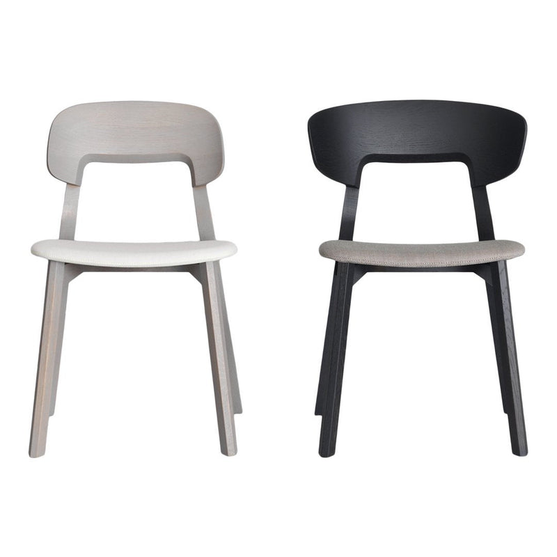"Set of two minimalist chairs: one in light gray and one in sleek black, featuring smooth, simple lines."