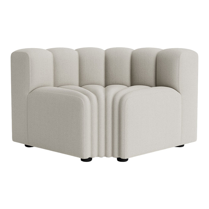 Textured light beige corner sofa with a modern curved design, showcasing soft lines and a minimalist aesthetic.