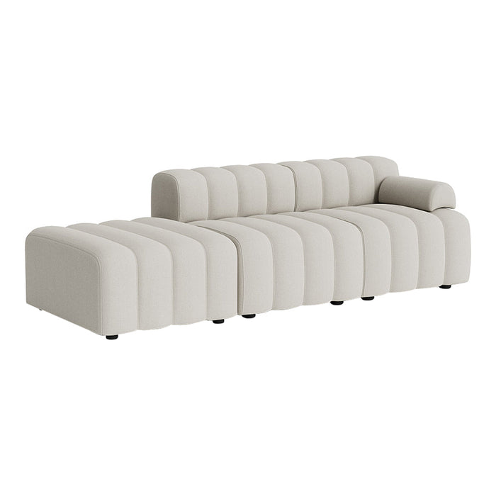Light beige sofa featuring a modern ribbed pattern and rounded edges for a sleek, stylish look.